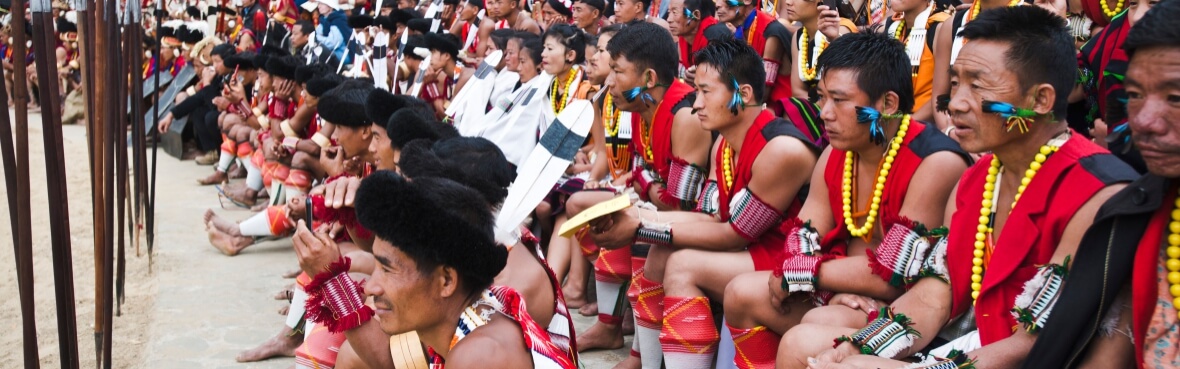 Group of Naga people in traditional outfit watching an event, Hornbill Festival, Kohima, Nagaland, India